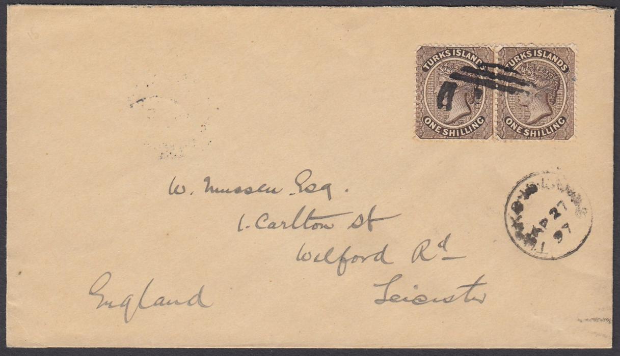 TURKS ISLANDS 1897 cover to Leicester, England, bearing pair 1s cancelled unclear T1 obliterator with Turks Islands cds in association, arrival backstamp; fine clean condition.