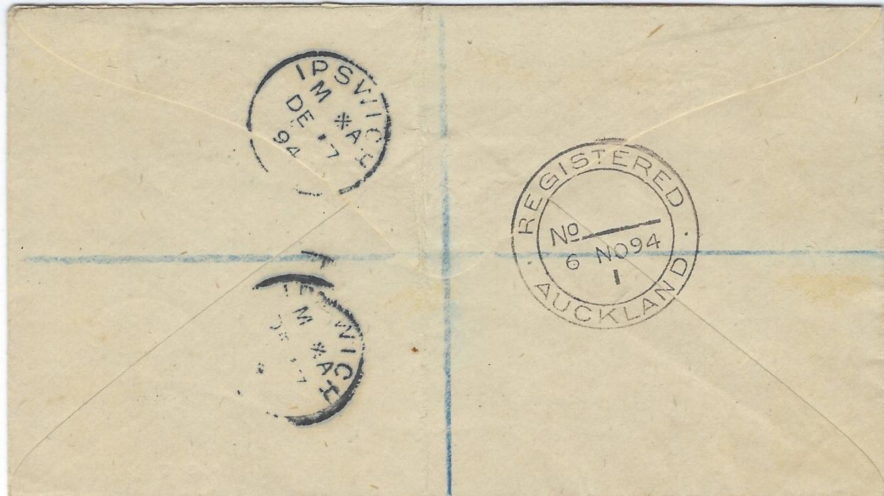 Tonga 1894 registered cover to England franked vertical pair 1/2d. on 1d. and two pairs of 2 1/2d. on 2d. in red and in black tied by neat cds, violet oval registration at centre, London Registration transit, reverse with Registered Auckland transit and Ipswich arrival cancels. The 11d. rate paying 6d. registration and 5d for double weight postage. Light vertical crease otherwise fine condition.