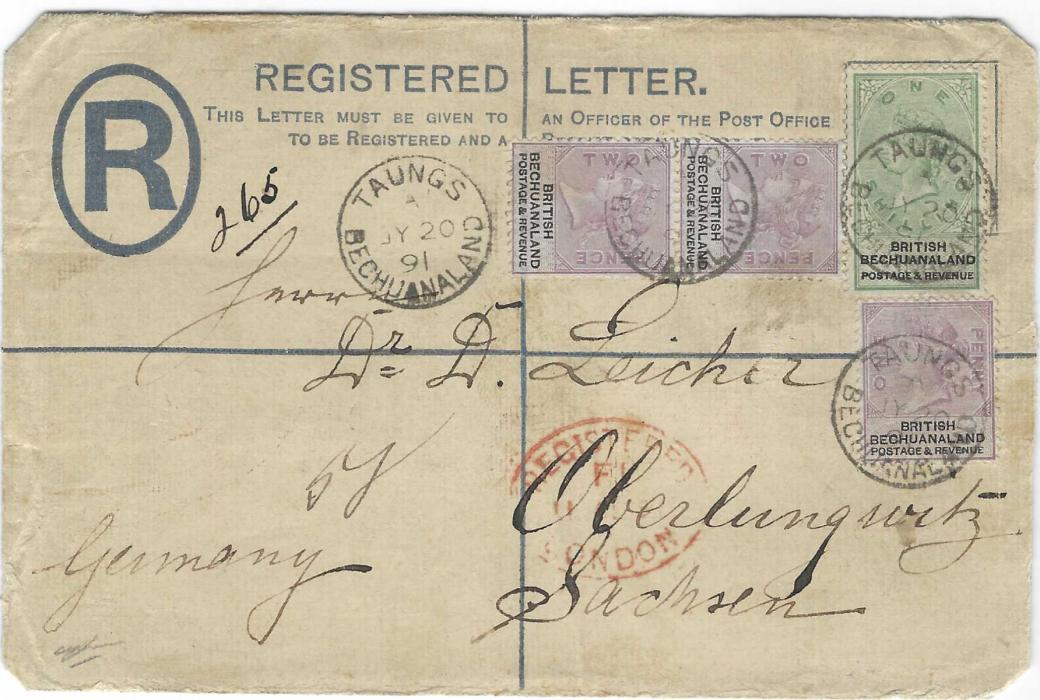 Bechuanaland 1891 registered stationery envelope to Germany uprated 1d., 2d. pair and 1s. tied Taungs cds, the stamp image is cancelled by numeral obliterator, Oberlungwitz arrival cds. Some damage to printed stamp image due to wax seal removal.