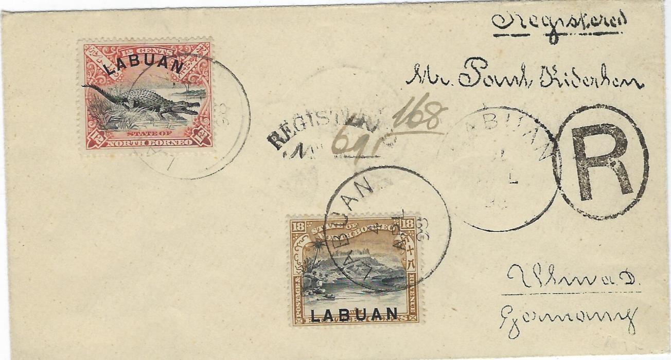 North Borneo (Labuan) 1898 registered cover to Germany franked 1897-1901 12c. Crocodile and 18c. Mountain tied Labuan cds, cursive registration handstamp with manuscript number, reverse with Milano transit and Ulm arrival cds.