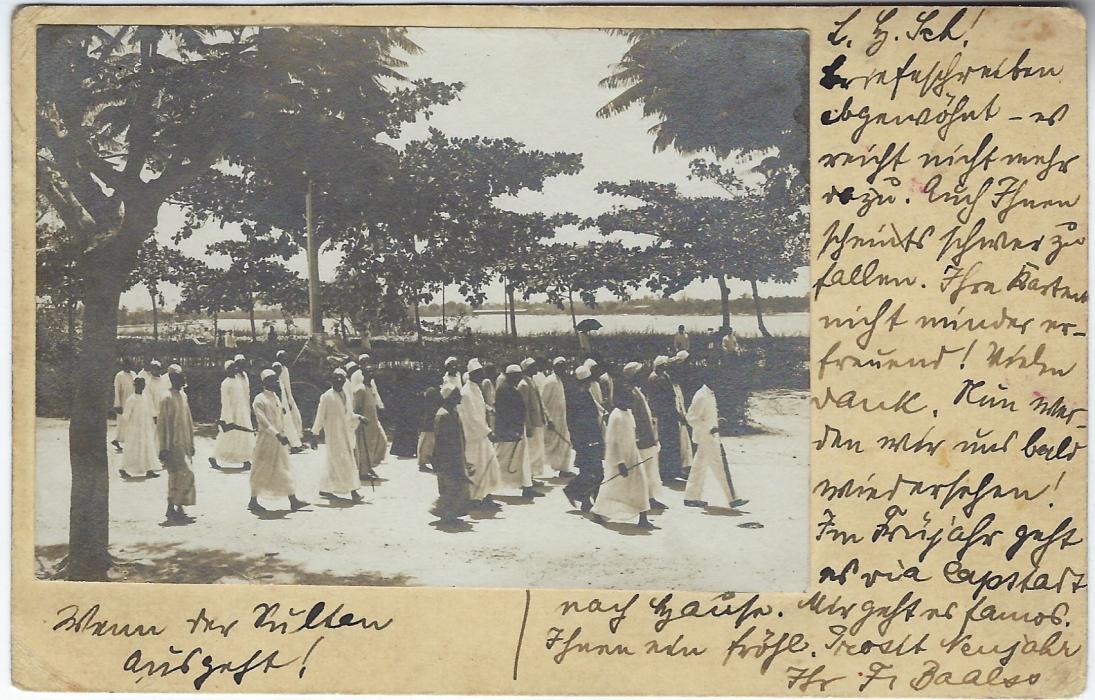 German Colonies (East Africa) 1908 (15/2) 4h stationery card cancelled Bagamoyo cds, the front of card with a photograph affixed of a group of Muslims waking down a street; unusual.