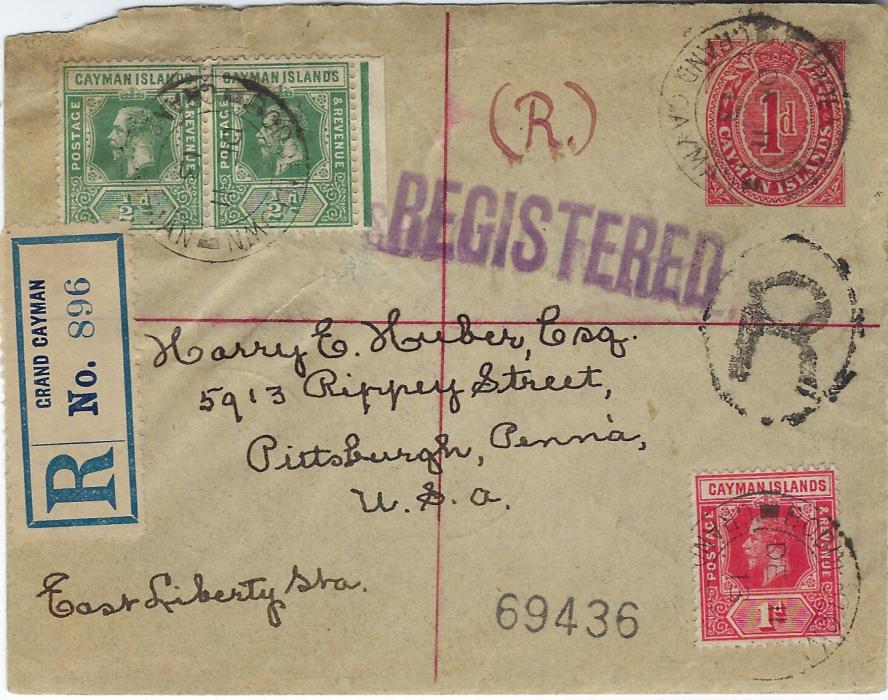 Cayman Islands 1913 1d. postal stationery envelope registered uprated to U.S.A. with 1912 ½d. (2) and 1d. on front plus on reverse two horizontal strips of three ¼d., one a plate marginal, tied Georgetown cds. The envelope has been repaired at left under the ½d. pair; a scarce correctly rated 4½d. stationery.