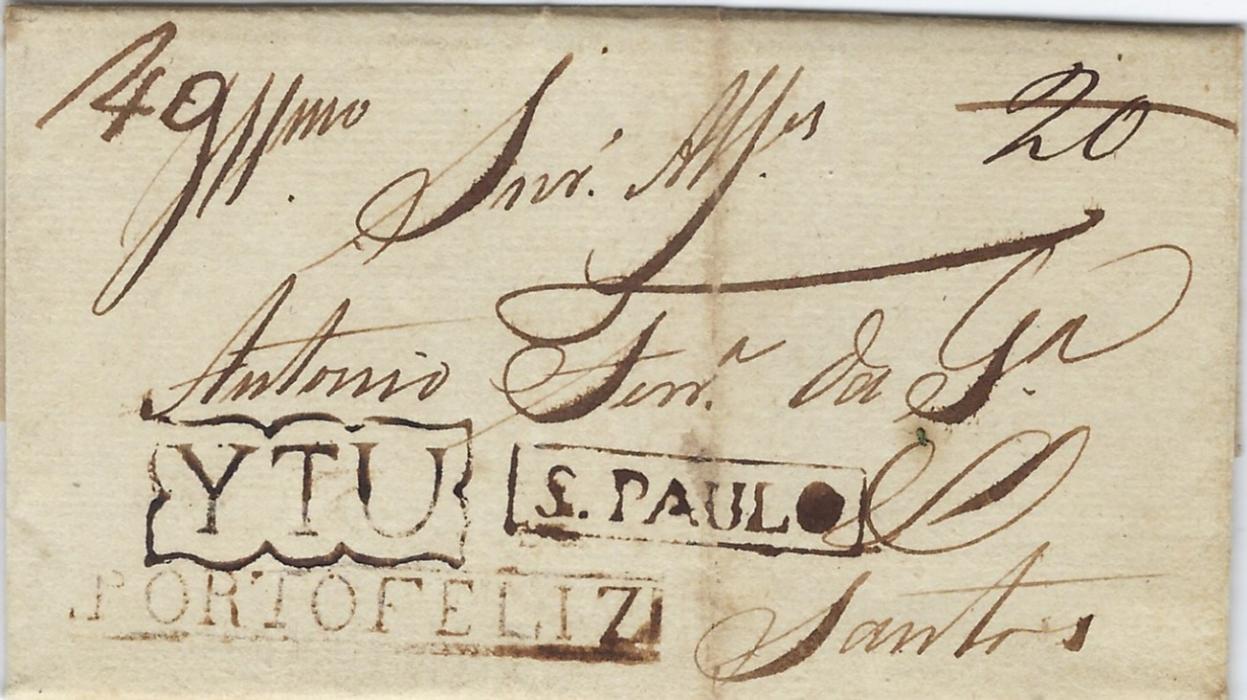 Brazil 1827 entire to Santos from the provinces of Sao Paulo, rated “20” which has been erased and altered to “40” at left side, bearing framed PORTO FELIZ handstamp in black, ornate framed Ytu and rectangular framed S.Paulo transits. Light vertical filing crease otherwise good fresh condition.