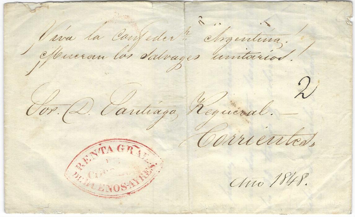 Argentina 1848 part entire to Corrientes bearing small “2” in manuscript and red oval-framed  Benta Gral/ De Correos/ De Buenos-Ayres, central vertical filing crease. There is a two-line endorsement at top that translates as ‘Long Live the Argentine Confederation! Death to the savage Unitarians!’