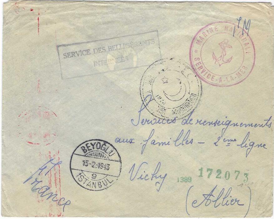 Turkey Internee Mail) 1943 (15.2.)  stampless free envelope addressed to Vichy  France  bearing violet framed ‘SERVICES/ des belligerant internes’, Beyoglu Istanbul despatch, double-ring crescent moon and star circular handstamp, red  Marine Francaise/ Service A La Mer ‘anchor’ illustrated handstamp, German censorship. Good condition.