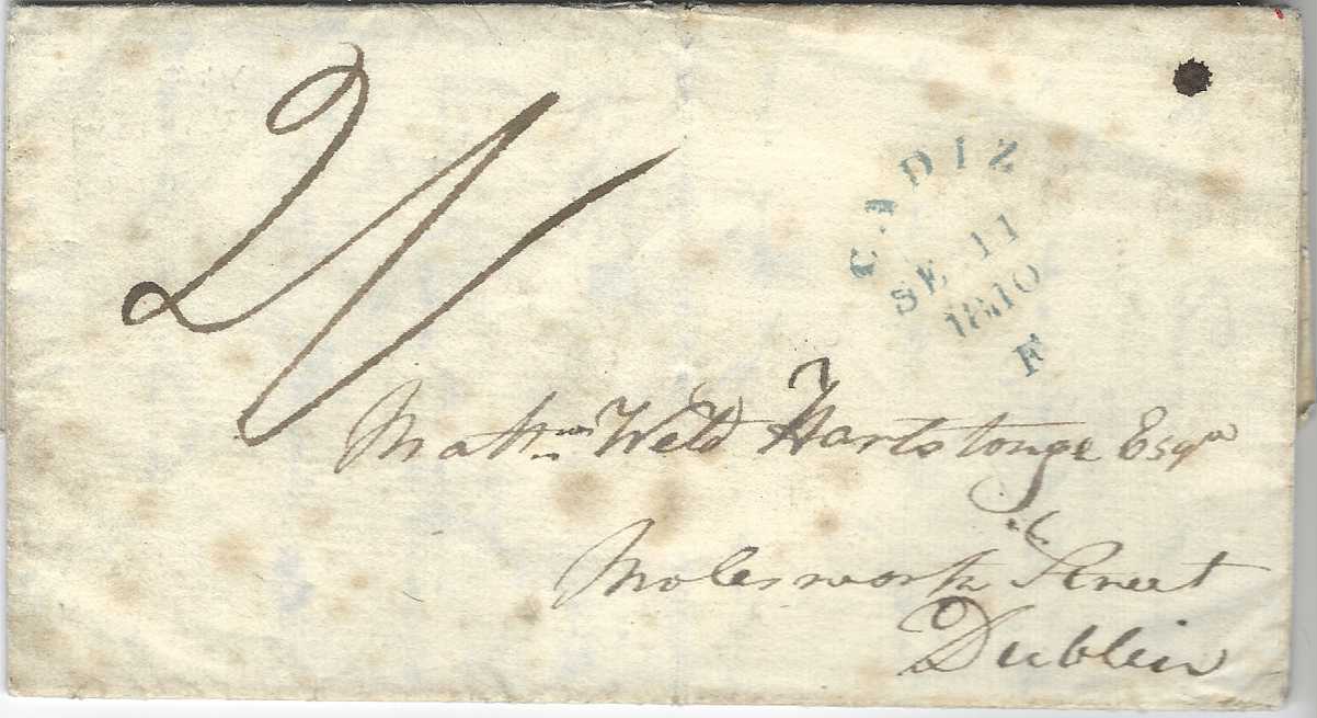 Spain 1810 (SE 11) entire to Dublin, Ireland that has been handed into British Consulate at Cadiz after the mail had closed and too late to be included in the mail bag and thus carried loose to Falmouth where green CADIZ/ SE 11/ 1810/F date stamp was applied, manuscript “2/-“ rate applied for mail to Falmouth and then overland to London and thence to destination. The envelope with some spotting, a good clear strike of this scarce cancel.