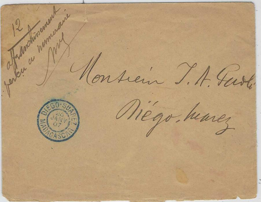 Madagascar 1907 (23 Janv) internal Diego Suarez stampless envelope with manuscript notation “affranchisement/ percu en numeraire”, fine blue Diego-Suarez , a couple of slight faults to envelope.