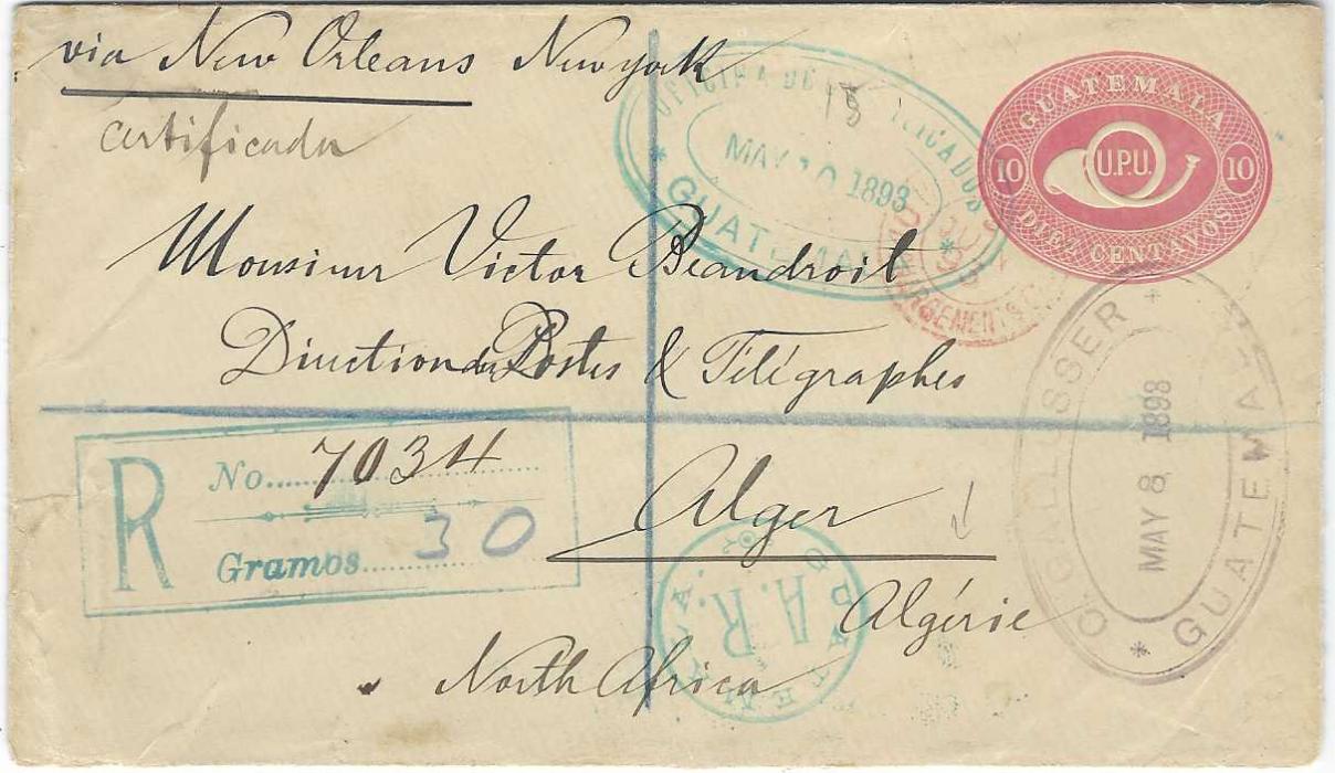 Guatemala 1893 (May 10) 10c. postal stationery envelope registered A.R. to Alger, Algeria, endorsed “via New Orleans New York”, cancelled with light blue-green Officine De Certificados oval-framed date stamp, registration handstamp with space for both number and weight, circular Guatemala A.R. handstamp, French red Chargements transits; fine condition.
