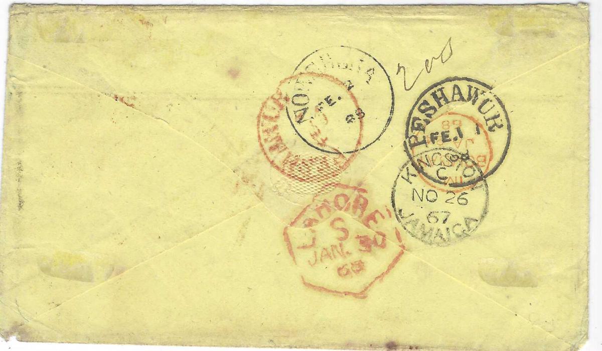 Jamaica 1867 (NO 26) buff envelope addressed to ‘77th Regiment, Peshawpur, Cabul, India”  (Afghanistan) franked 2d., 3d. and 4d. (strip of three with right hand stamp damaged at top) tied by ‘A01’ obliterators routed via London, rated “1/4”and handstamped ‘1d’, reverse with Kingston despatch, red Bombay cds (JA 24) and hexagonal Lahore (Jan 30), Peshawur in red and black both FE.1 and Nowshara arrival of FE 2. A striking cover to a most unusual destination. Ex H. Wood.