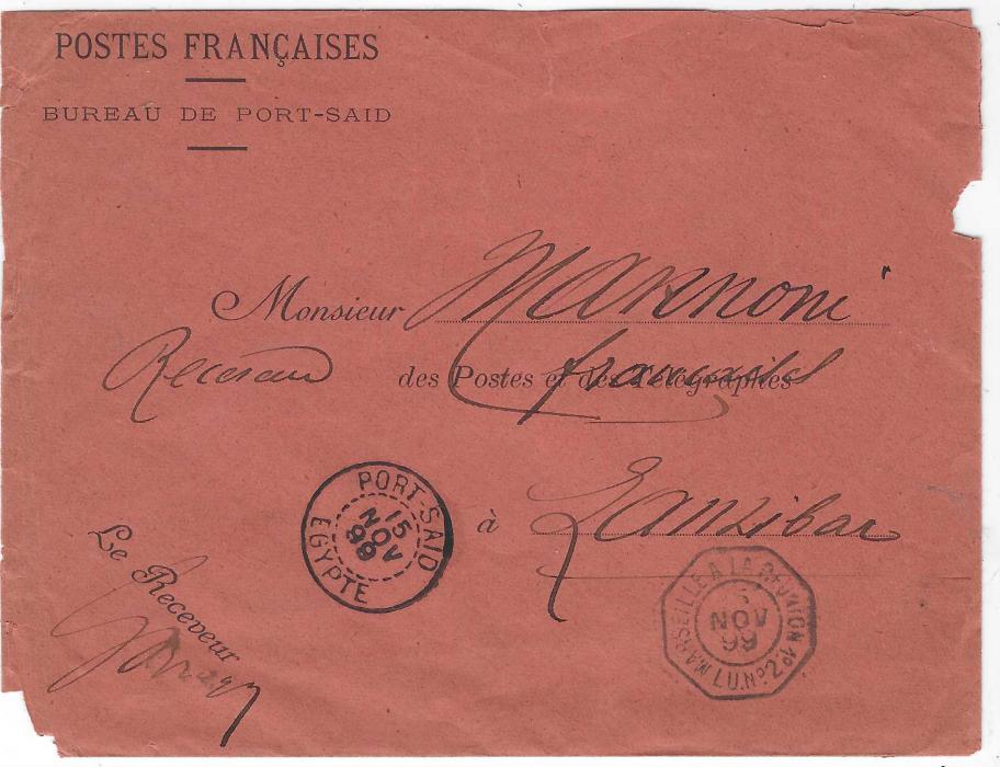 Egypt  (French Post Offices) 1899 (15 Nov) red official stampless envelope headed ‘Poste Francaises/ Bureau De Port Said’ addressed to the French Post Office at Zanzibar bearing Port Said Egypte despatch and octagonal Marseille a La Reunion Lu.No.2 maritime date stamp. The letter with printed heading UNION POSTALE UNIVERSELLE containing information an queries about paquebot connections from Zanzibar. Some faults to envelope, unusual survivor.