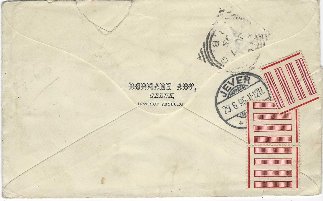 Bechuanaland 1895 (JU 6) envelope ornately addressed to Jever, Germany franked Great Britain overprinted 1888 ½d. vermilion and 1891-1904 1d. (2, one missing bottom right corner) and 2d. cancelled ‘181’ obliterators with Geluk B.B. cds at left, transit and arrival backstamps; envelope torn and repaired on reverse.