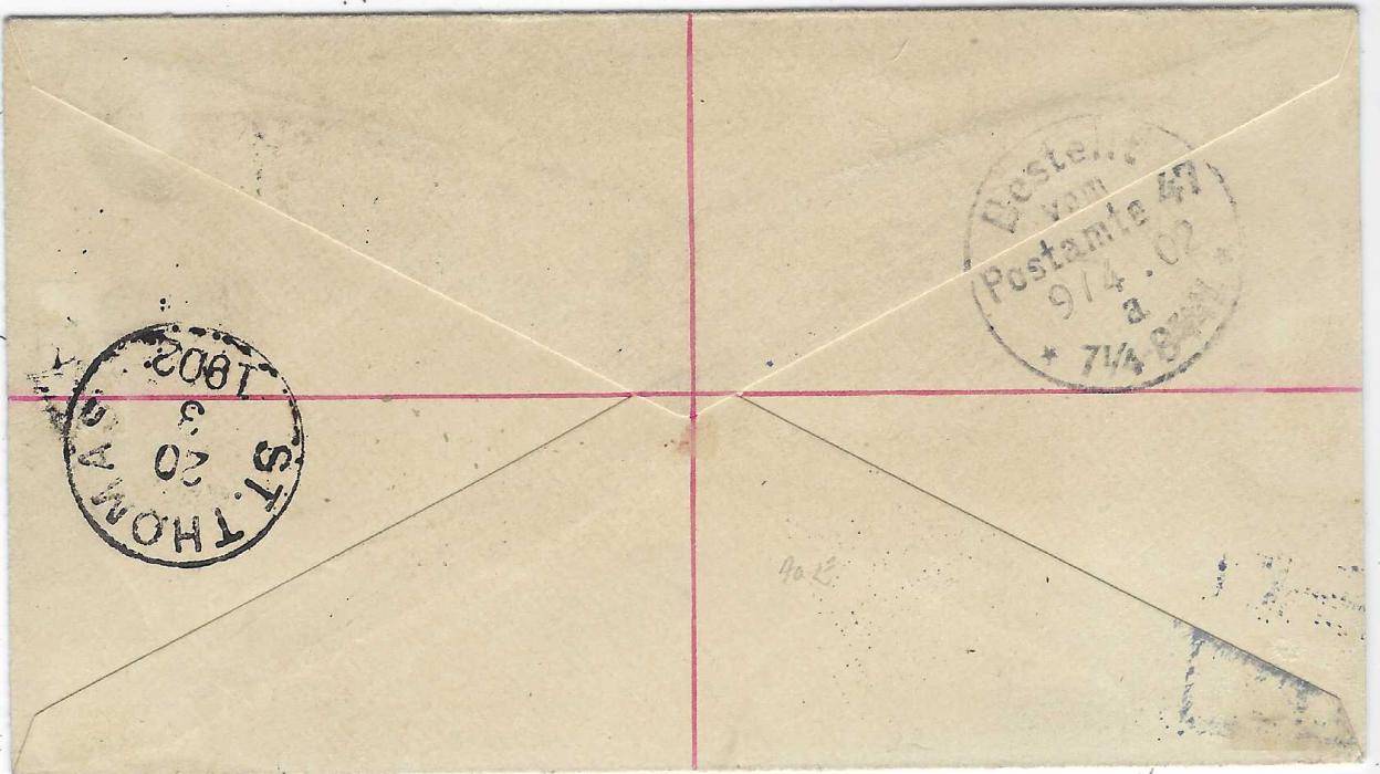 Virgin Islands 1902 (MR 13) 2½d. postal stationery envelope registered and uprated with ½d., 2½d. and 1/-  ‘Madonna’ to  Berlin tied TORTOLA cds, black ‘R’ in oval handstamp with blue crayon manuscript number which is overstruck with blue Danish West Indies registration handstamp with black manuscript number, St Thomas transit backstamp and arrival cds (9/4)