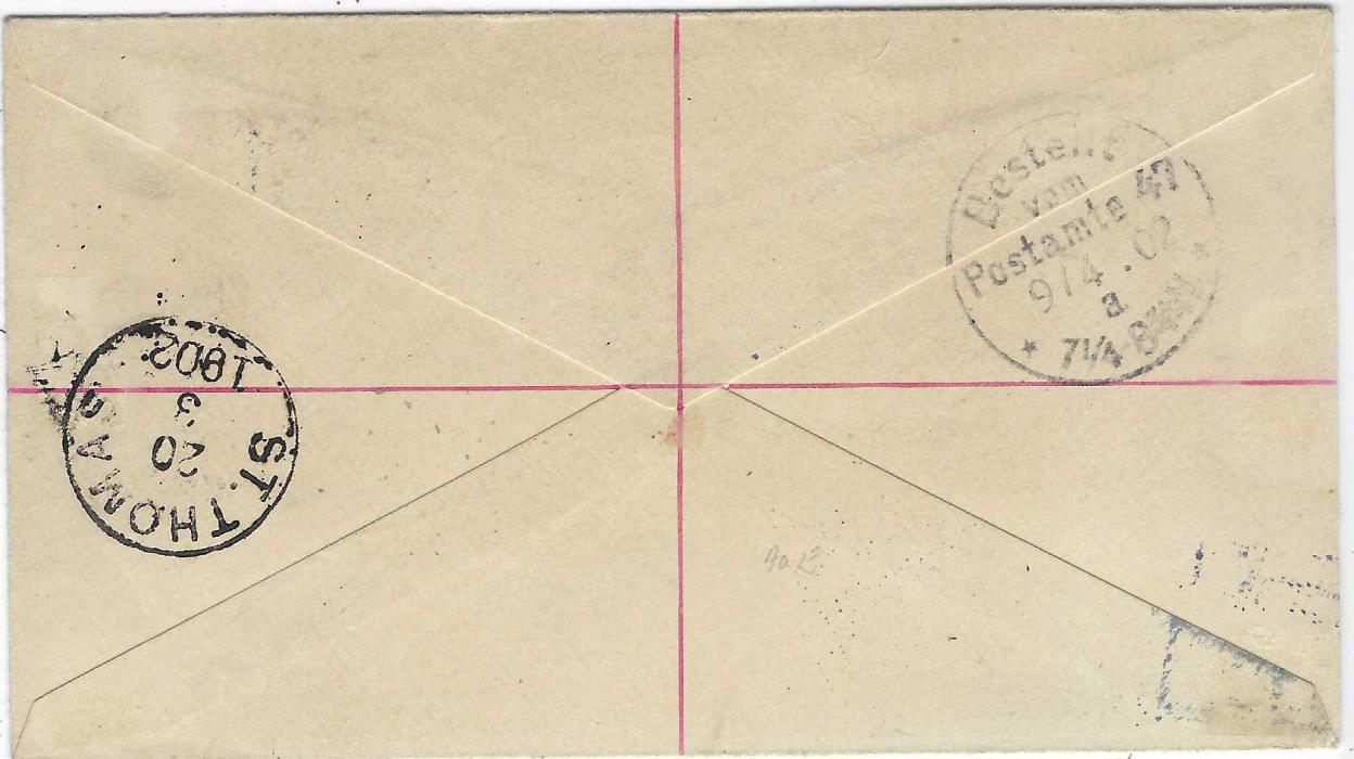 Virgin Islands 1902 (MR 13) 2½d. postal stationery envelope registered and uprated with ½d., 2½d. and 1/-  ‘Madonna’ to  Berlin tied TORTOLA cds, black ‘R’ in oval handstamp with blue crayon manuscript number which is overstruck with blue Danish West Indies registration handstamp with black manuscript number, St Thomas transit backstamp and arrival cds (9/4)