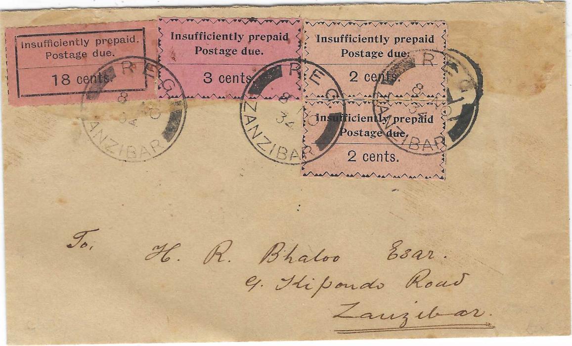 Zanzibar 1934 stampless incoming envelope cancelled on reverse PAQUEBOT ZANZIBAR (27 OC), circular framed ‘T’ handstamp overstruck with Postage Dues 1926-30 18c. black/orange and 1930-33 rouletted 5 2c. black/salmon vertical pair and a 3c. black/rose tied by three REG ZANZIBAR datestamps of 8 NO; some glue staining, fine mixed issue franking