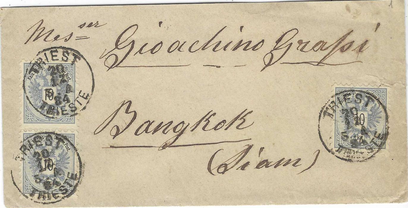 Austria 1884 (20/12) envelope to Bangkok, Siam franked three 10Kr. tied Triest Trieste cds, reverse with Napoli transit overstruck by a further unclear cancel, below left a red SINGAPORE/ PAID  date stamp of JA 19 85.; good clean condition.