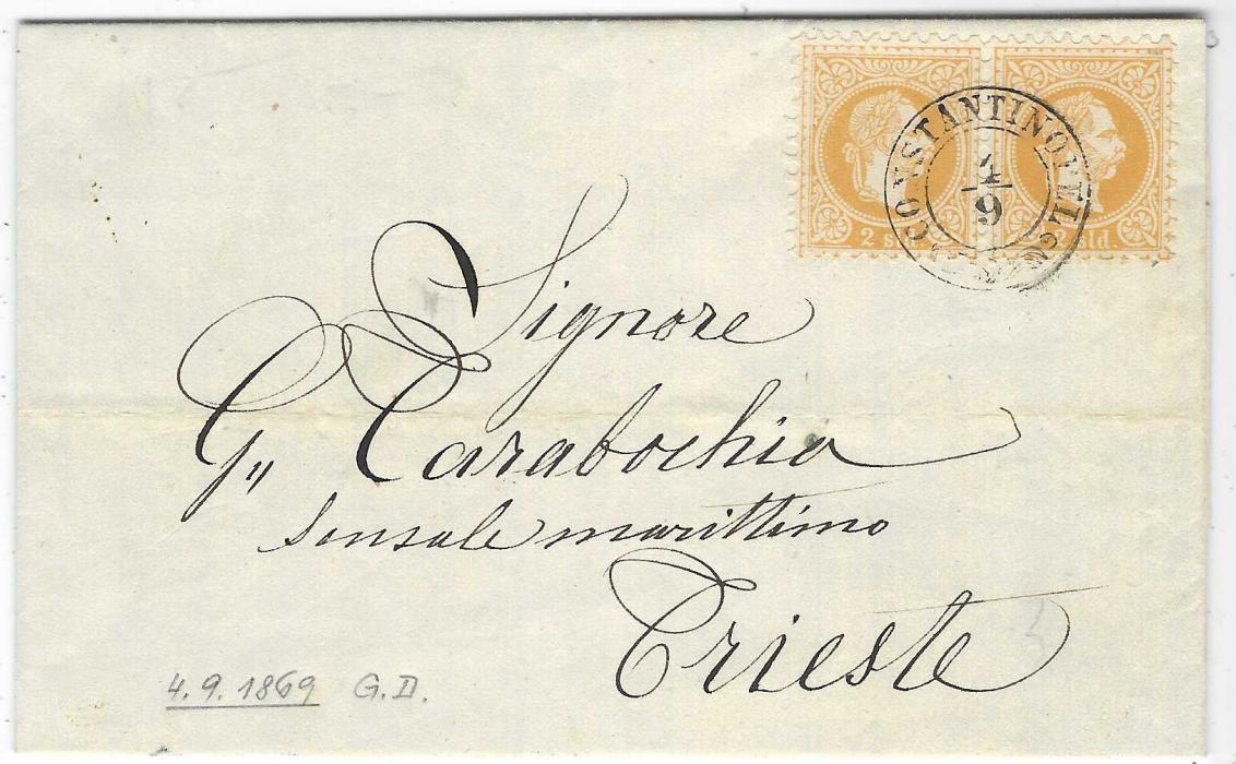 Austrian Levant 1869 (4/9) printed entire to Trieste franked 1867 Coarse Whiskers 2s. yellow horizontal pair tied fine wreathed CONSTANTINOPEL , arrival backstamp. A Light horizontal filing crease otherwise very fine with stamps exceedingly fresh. Ex Monte Napoleone and Provera.