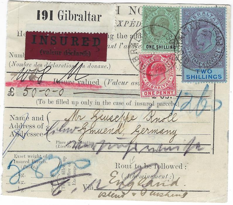 Gibraltar 1911 insured parcel card for £50 to Gmuend, Germany franked 1909-11 New Colours 1d. red, 1s. black/green and 2s. purple and bright blue/blue tied by two cds, arrival backstamps; left section removed and vertical filing crease, a scarce item.