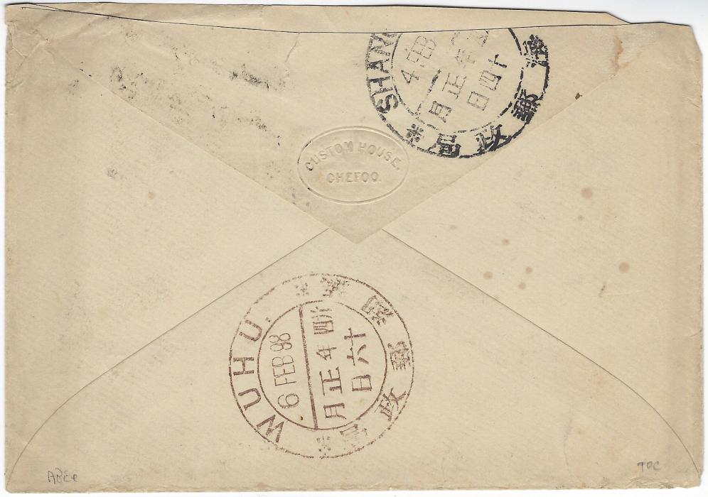 China 1898 (2 Feb) “On Postal Service” envelope (embossed “Custom House, Chefoo” seal on flap) addressed to Wuhu, showing Service des Postes circular cachet and Chefoo dollar chop, reverse with black Shanghai  (4.2.) and brown Wuhu (6.2.) dollar chops. Envelope slightly reduced at top. A rare stampless inter office item.
