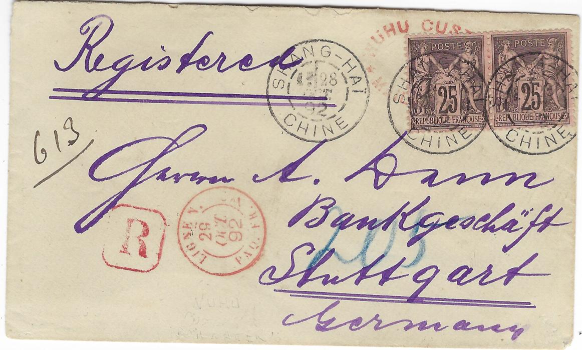 China (Mail Matter) 1892 (26 Oct) registered envelope from Wuhu to Stuttgart, Germany, showing Wuhu Customs/Mail Matter unframed oval handstamp in red, matching Customs/Wuhu double-ring datestamp and blue Customs/Shanghai  double-ring datestamp (Oct 28) on reverse, and bearing France Peace and Commerce 25c pair applied over the Customs Mail Matter handstamp and cancelled by Shang-hai/Chine cds), with ‘R’  framed handstamp and Ligne N/Paq. Fr. No. [?]  cds both in red adjacent, “Stuttgart” arrival cds (3.12) on reverse, insignificant piece of flap at back missing, Very Fine and appealing.