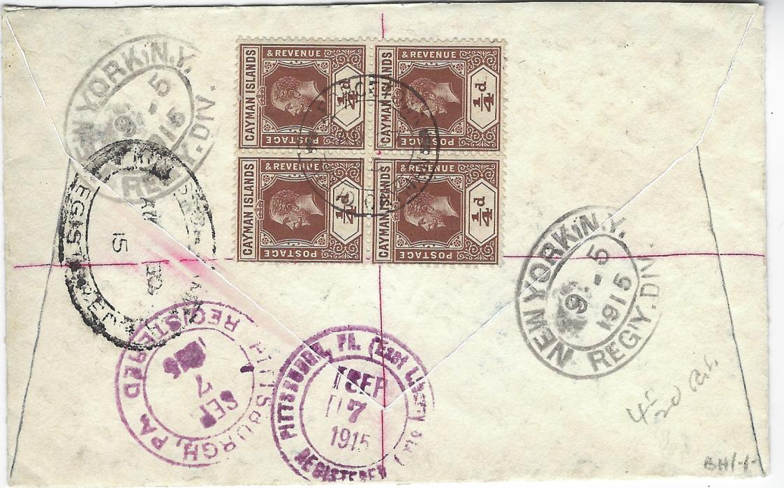Cayman Islands 1915 (AU 27) registered cover to Pittsburg, USA franked 1907-09 2½d. ultramarine and 1913 ¼d. blocks of four both front and back, cancelled by double circle Georgetown Grand Cayman date stamps, blue framed manuscript registration at bottom left, straight-line violet American registration, reverse with Jamaica transit, New York transits and arrival cancels; good condition, franked at correct 4½d. rate.