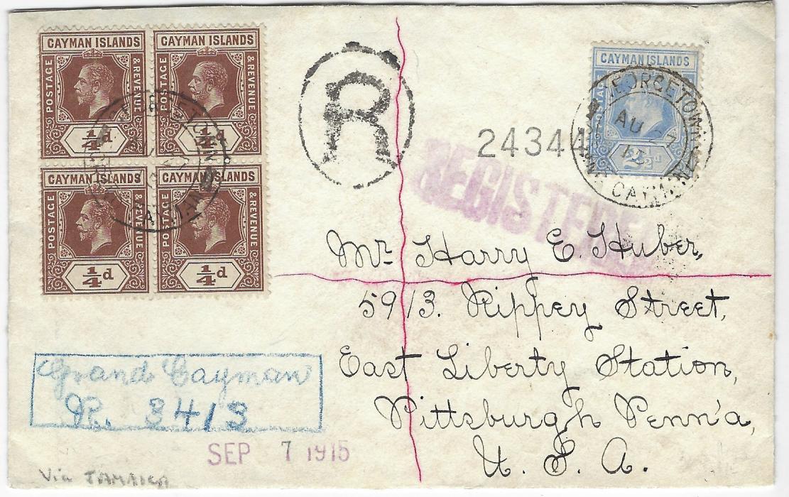 Cayman Islands 1915 (AU 27) registered cover to Pittsburg, USA franked 1907-09 2½d. ultramarine and 1913 ¼d. blocks of four both front and back, cancelled by double circle Georgetown Grand Cayman date stamps, blue framed manuscript registration at bottom left, straight-line violet American registration, reverse with Jamaica transit, New York transits and arrival cancels; good condition, franked at correct 4½d. rate.