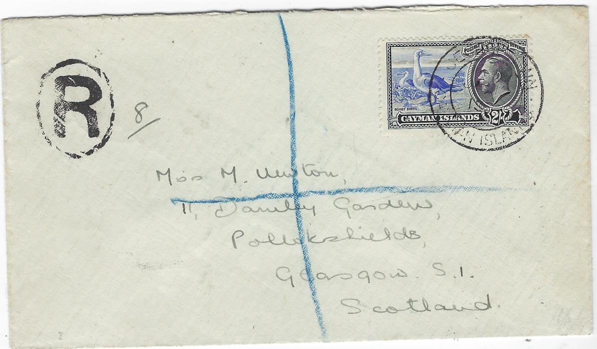 Cayman Islands 1937 (JA 13) registered cover to Scotland bearing single franking 2/- ‘Booby’ tied Georgetown cds, registration handstamp at left with manuscript “8” number alongside, Jamaica transit backstamp.