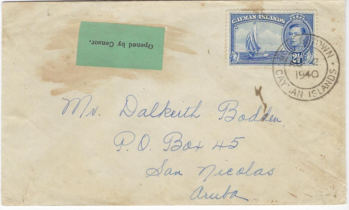 Cayman Islands 1940 (AU 2) cover to San Nicolas, Aruba, Netherland West Indies bearing single franking 2½d. tied Georgetown double ring cds, with to left ‘Opened by Censor’ apple green label with stop (a late date), reverse with Curacao transit (28.8.) and arrival cds (30.8.). Some glue staining around label, scarce 
