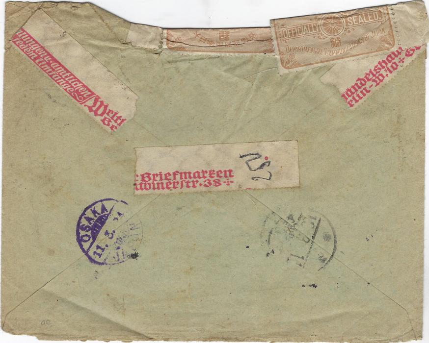 Japan 1924 (28.1.) registered cover from Berlin, Germany to Osaka, the envelope damaged in transit and two Officially Sealed labels applied at top, arrival backstamps, remains of delivery label at base.