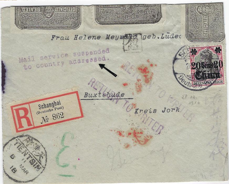 China (German Post Offices) 1917 registered cover from a German Consulate to Buxtehude, Germany bearing single franking 20 Cents 20 on 40pf tied Schanghai Deutsche Post cds, New York transit backstamps (2.7. and 2.8.) where the cover was intercepted and two-line ’Mail service suspended/ to country addressed’  and two ‘RETURN TO WRITER’ handstamps applied, envelope opened for return address and sealed by three perf 12 Officially Sealed labels, duly returned via Tientsin (6 Mar 18) to Shanghai (9 Mar) where censored with the rare bilingual label tied by two red seals of censor and bilingual Shanghai cds; small ink stain at left otherwise a fine and rare item.