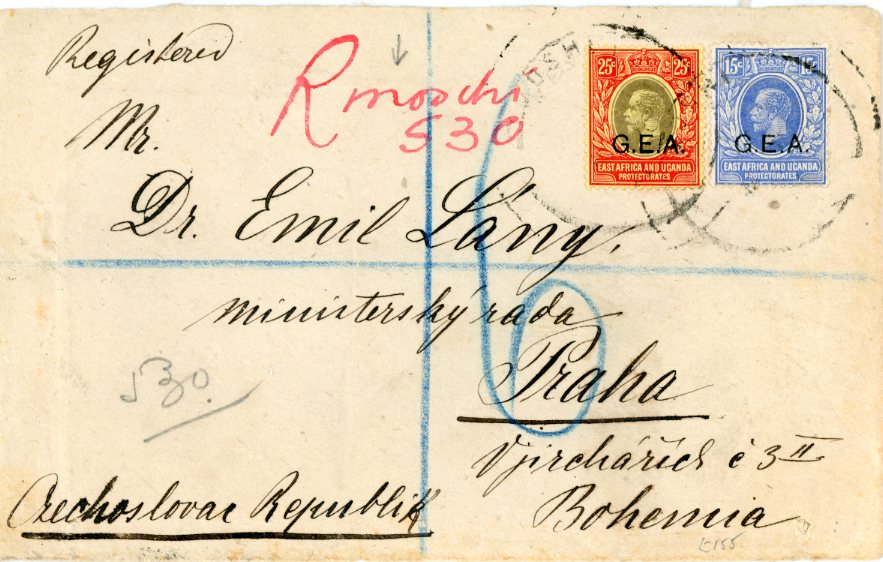 TANGANYIKA TANGANYIKA: 1921 Envelope registered to Praha, Bohemia franked East Africa 15c. bright blue + 25c. black and red / yellow tied by large MOSHI c.d.s’s (unclear) with manuscript ‘R moshi 530’ in red registration alongside, Mombasa transit and indistinct arrival backstamps, a few small envelope issues not affecting stamps, scarce.