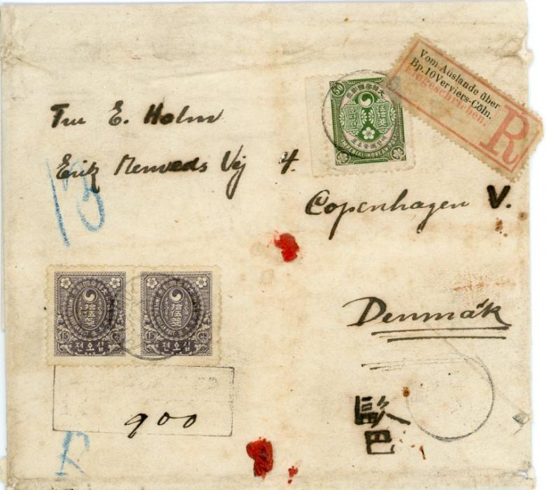 KOREA KOREA: 1900/01, Ewha 50ch., a left marginal copy with 15ch. horizontal pair tied ‘Chemulpo .. Nov 02’ to registered higher weight wrapper to Copenhagen/Denmark. On reverse transits Shanghai French office ‘25 Nov 02’, French mail steamer octagonal ‘Marseilles a YOKOHAMA L.N. No. 8 29 Nov 02’ and ‘Copenhagen 1.1.03’ arrival. Also bears a German TPO R-label ‘From foreign via railway mail p.o. 10 Verviers-Cologne’. Remarkable commercial usage of the 50ch. plum blossom. Unreported item, from old Danish family correspondence, wrapper with some faults.