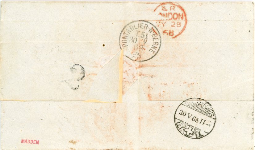 GUATEMALA GUATEMALA: 1868 (16 Avril) folded stampless cover to Switzerland with CORREOAS GUATEMALA blue dispatch cds, red boxed FRANCO alongside with French accountancy marks F/31 and GB / 1f 90c, PANAMA / TRANSIT and French entry mark all on front, rated 1.30 in red crayon, London TPO transit backstamp, La Chaux de Fonds arrival, fine, handstamped ‘MADDEN’ in red.