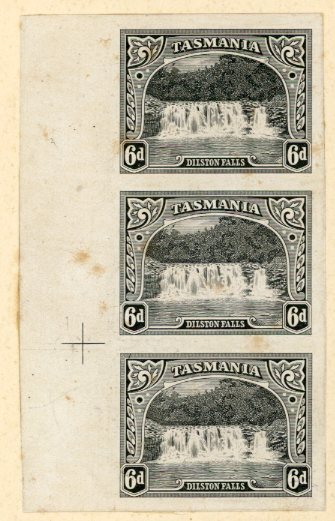 TASMANIA AUSTRALIA - TASMANIA: 1899/1900: Pictorials Dilston Falls 6 d. plate proof in black on glazed card in a vertical strip of three from the left of the sheet with perforation guide cross in the margin, the lower example with Diagonal Line through Left Value Tablet and the upper example with Diagonal Line through Upper-Left Ornament, mounted on a large-part page (175 x 142 mm) from the printers record book endorsed 