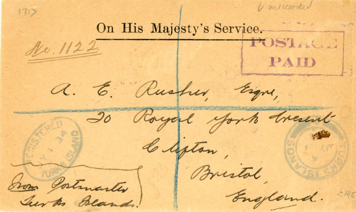 TURKS ISLAND TURKS ISLAND: 1924 (JY !) Registered OHMS envelope to England with violet boxed POSTAGE/PAID in unrecorded type (Challis has thin unseriffed letters), oval Registered Turks Island ds and Turks Island cds, both in the same blue shade, sent from the Postmaster, various New York transit oval bss, fine.