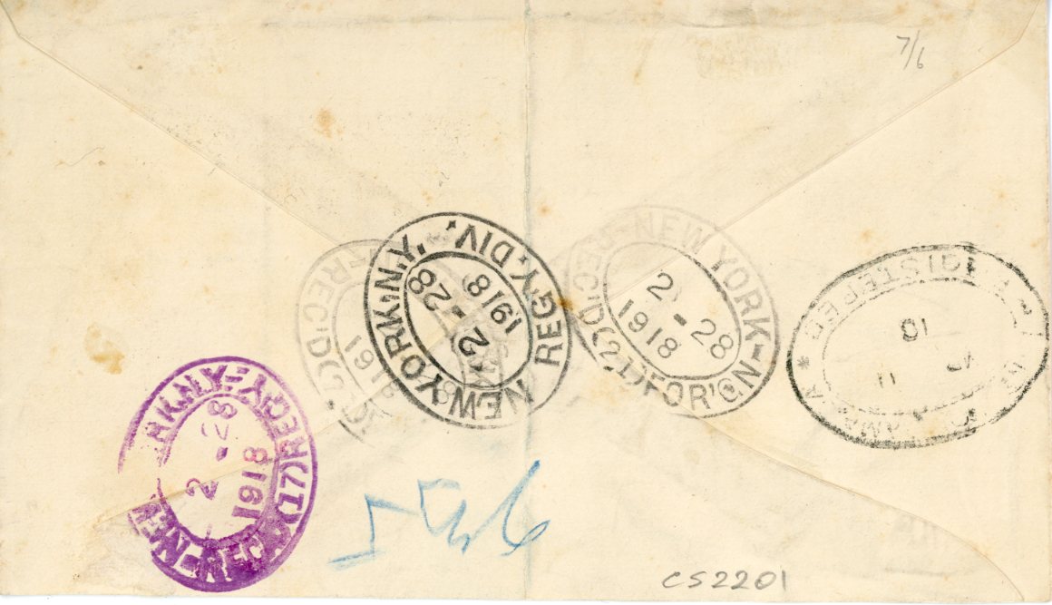 TURKS and CAICOS ISLANDS TURKS and CAICOS ISLANDS: 1918 (FE 18) registered envelope to Jamaica franked 1917 WAR TX ovpts. on 1d red horizontal strip of 3 + 3d, 1d strip showing obvious double ovpt., most notably on the left hand adhesive, all stamps tied by Turks Islands cdss, New York transit bss (2 28) and Kingston arrival, central vertical crease appears to go under the left hand stamp (presumably cover was creased before usage), stamp also tied by blue crayon registration crayon, very scarce usage.