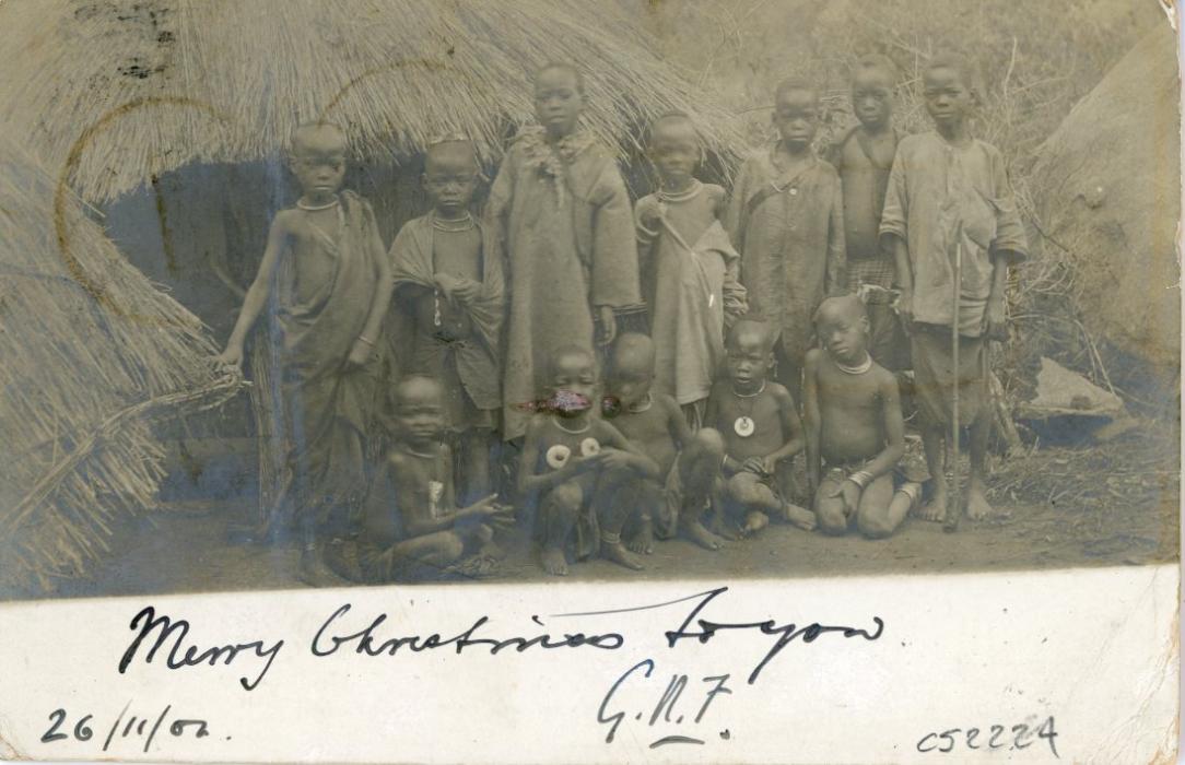 RHODESIA RHODESIA: 1902 (27 NOV) 1d red stationery card illustrated with photo on reverse of native children in front of a hut with Christmas Greetings, readdressed on arrival to Italy with San Remo cds (22 12) and violet hotel cachet, small imperfections.