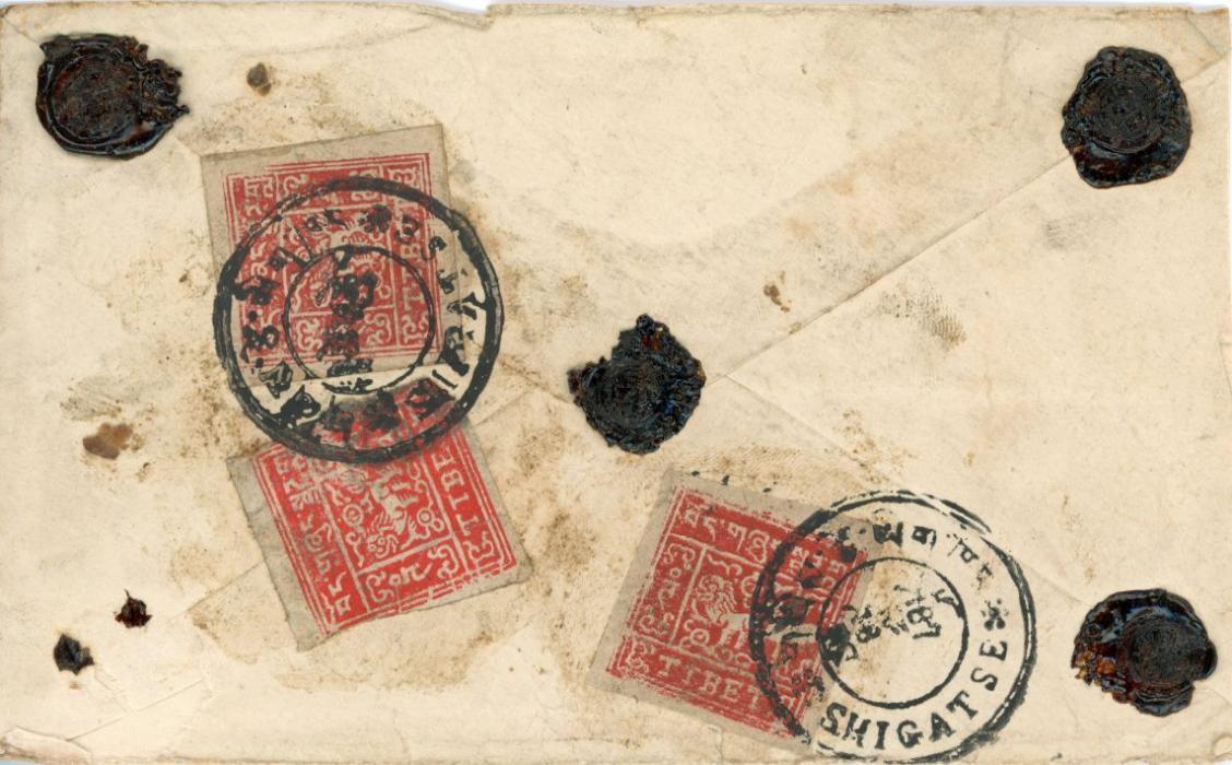 TIBET TIBET: ca early 1950s registered insured cover from Shigatse to PHARI franked on reverse1t scarlet (3) tied by Shigatse VIII cancel (Hell T46). Note the cancels have been strategically placed to cover the value figures of all stamps. For quite a long time 1tr & 2tr stamps were printed in the same colours. This led to postal fraud by postal clerks who sold 1tr stamps for 2tr.Insured for 5 rupees. Dated Jan 30th, no year, with seals, small peripheral faults to envelope, 1 stamp cut into. Opinion G.Flack.