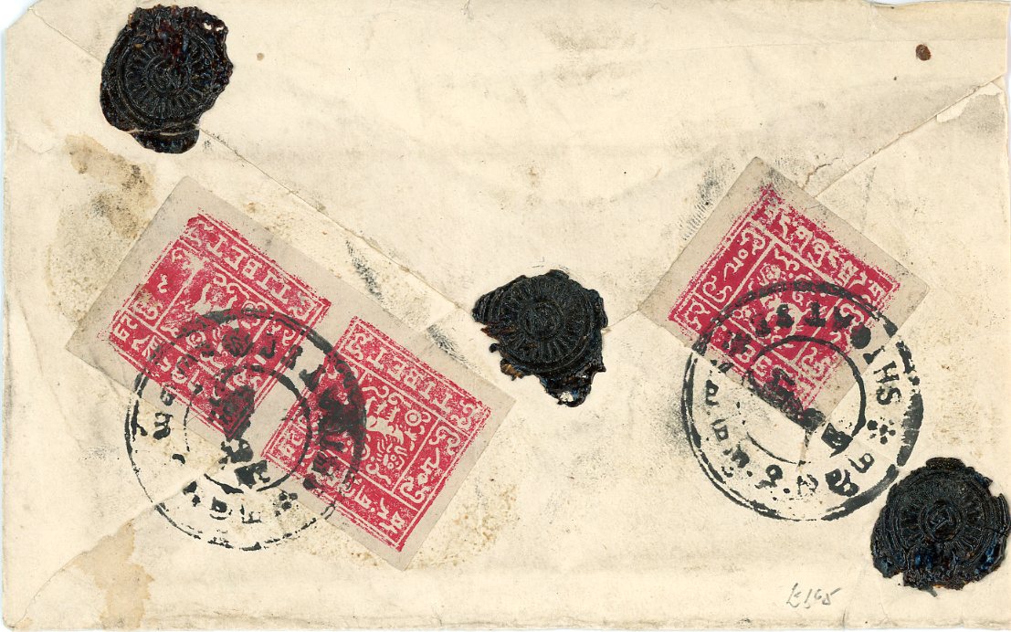 TIBET TIBET: 1950s internal envelope franked on reverse 2t scarlet (pair + single) tied y Shigatse cdss, distinct shades, single much more intense, 3 wax seals alongside, envelope slightly reduced at left.