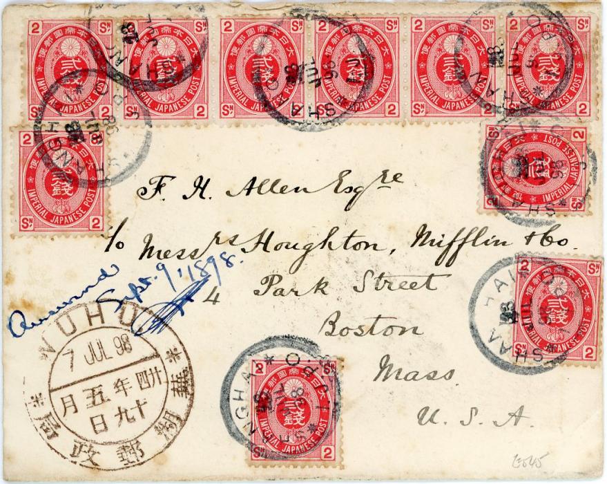 JAPAN / CHINA JAPAN / CHINA: 1898 (23 JY) envelope to USA franked Japan 2s carmine rose strip of 6 + 4 singles, originating in WUHU with 7 July large dollar chop in brown, all tied by Shanghai I.J.P.O. cdss, Shanghai large dollar chop on reverse, Yokohama transit (26 Jul), Boston Received 5 Aug 15 duplex, back panel with small missing piece (possibly a wax seal) and a few minor perf. issues and tonespots, impressive franking