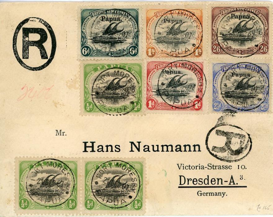 PAPUA PAPUA: 1907 (21 Dec) Printed registered envelope to Germany franked 1906 large ovpt. 6d + 2s6d & small ovpt. 1d + 2 1/2d + 1s & 1907-10 1/2d (pair + single) all tied Port Moresby cds, Reg. Sydney Ja 6 transit & Dresden arrival (7.2.08), philatelic, fine