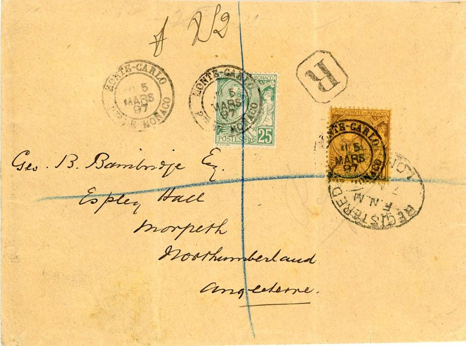 MONACO MONACO: 1897 (5 Mars) registered envelope to England franked 1891-94 25c + 50c tied by Monte-Carlo cds and additionally by blue crayon registration, Morpeth 8 Mr arrival, 50c further tied by oval London reg.ds (7 Mr), vertical creases not affecting adhesives